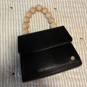 Black boutique bag with wood bead handle